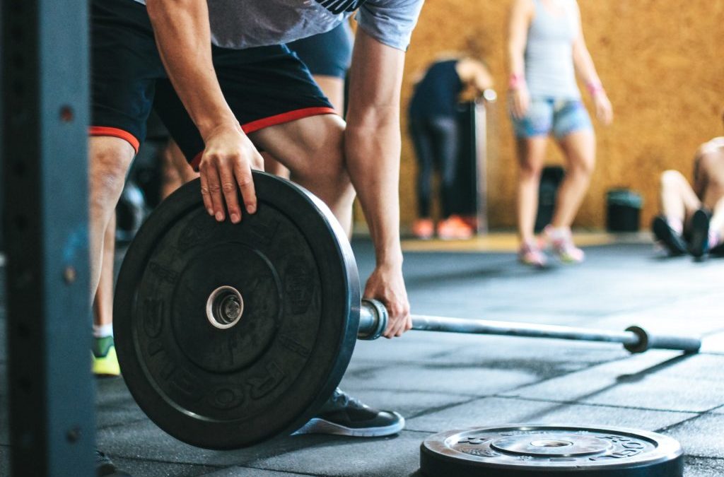 Loading a barbell with weight