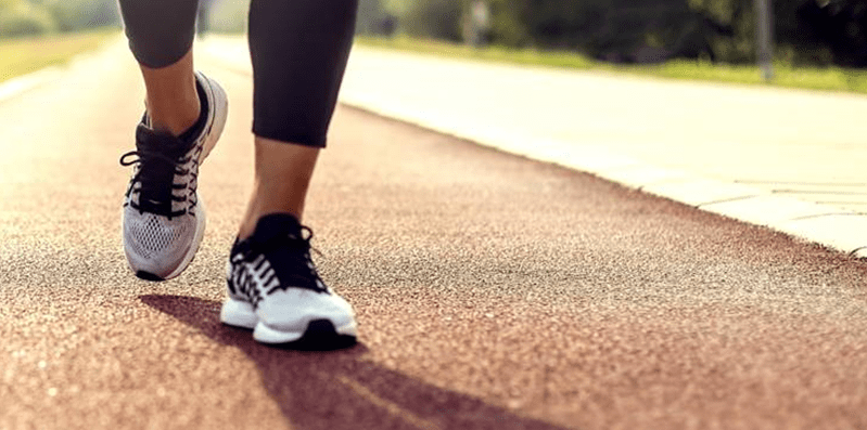 Woman walking on an outdoor path