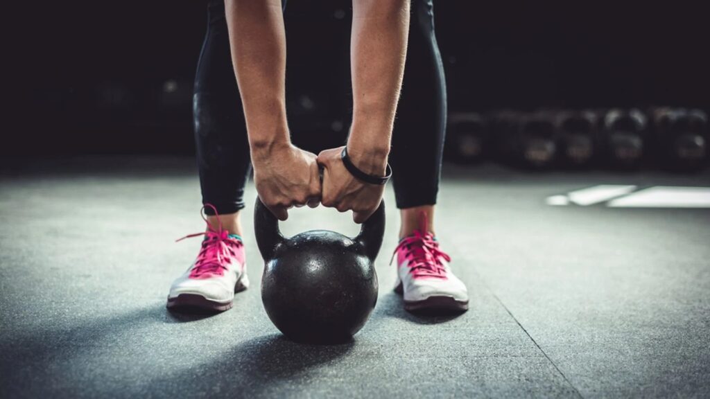 Holding a kettlebell before an exercise