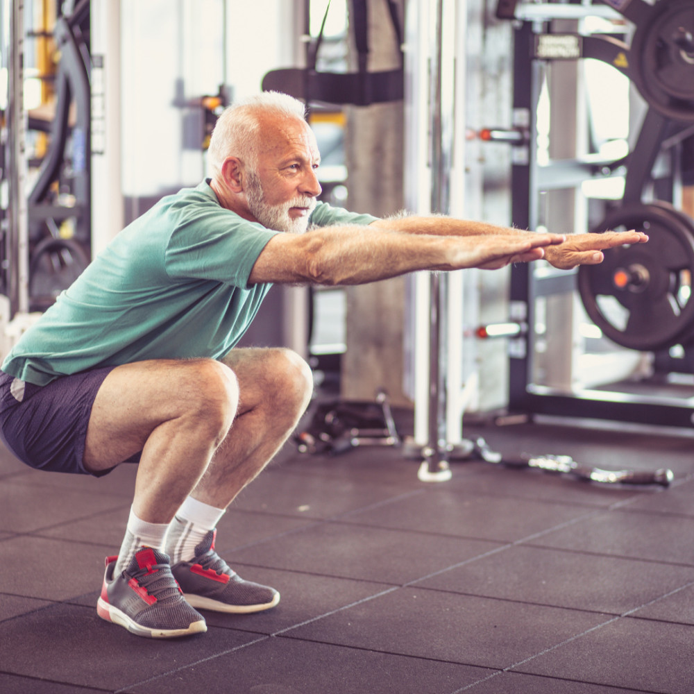 Man doing squats during an exercise